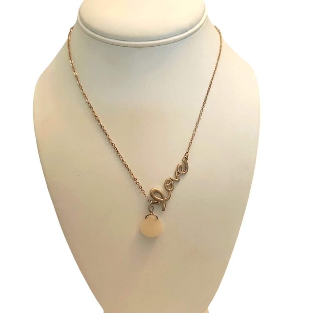 Elegant Gold Necklace with Milk Glass Teardrop Pendant and Circular Accents